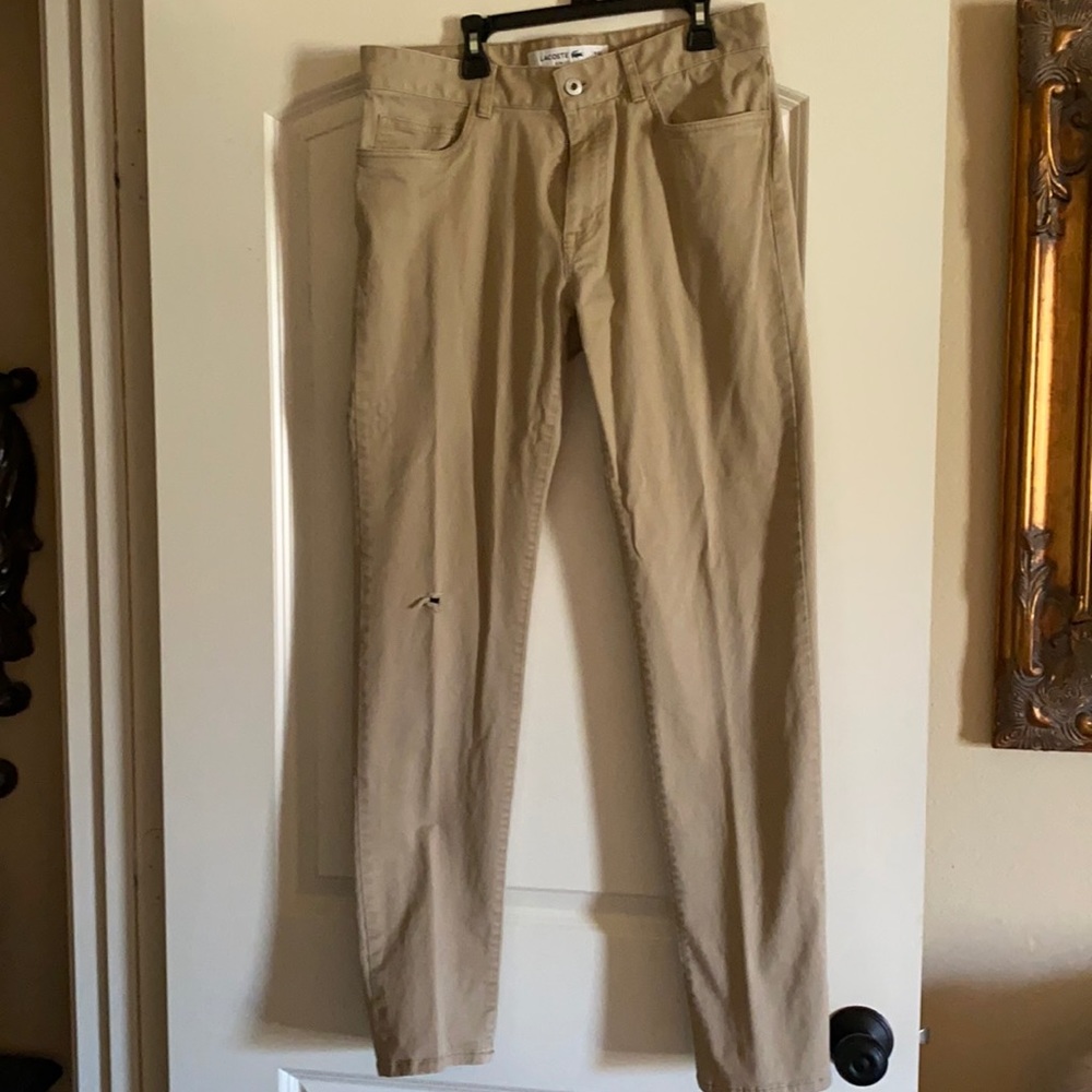 Lacoste flat front khakis. Slim fit 32x34.